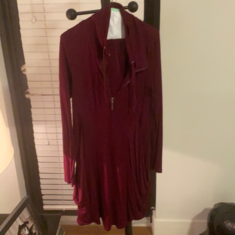 it's a nice dark red sweater very long it's very nice to go out on a cold day